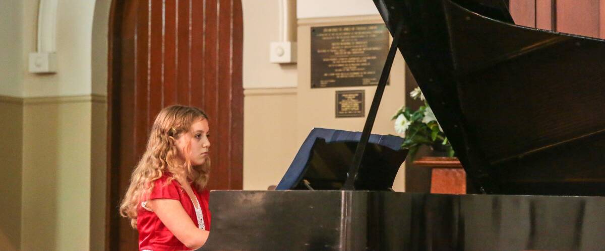 Cedar-Rose Newman, 11, of Wombarra, competes in a piano solo section at this year’s eisteddfod at the Wesley Church in the mall, Wollongong. Picture: ADAM McLEAN
