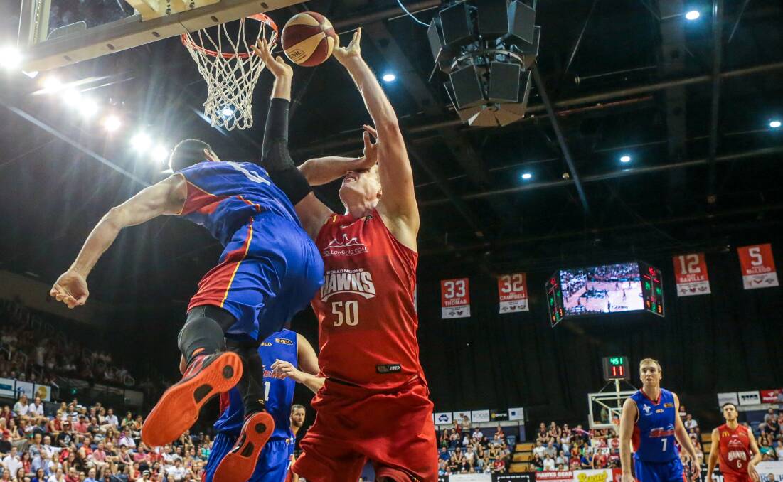 Luke Nevill (Hawks) is shut out by 36ers Tom Daly in a game that looked much the same way throughout.  Picture: ADAM McLEAN