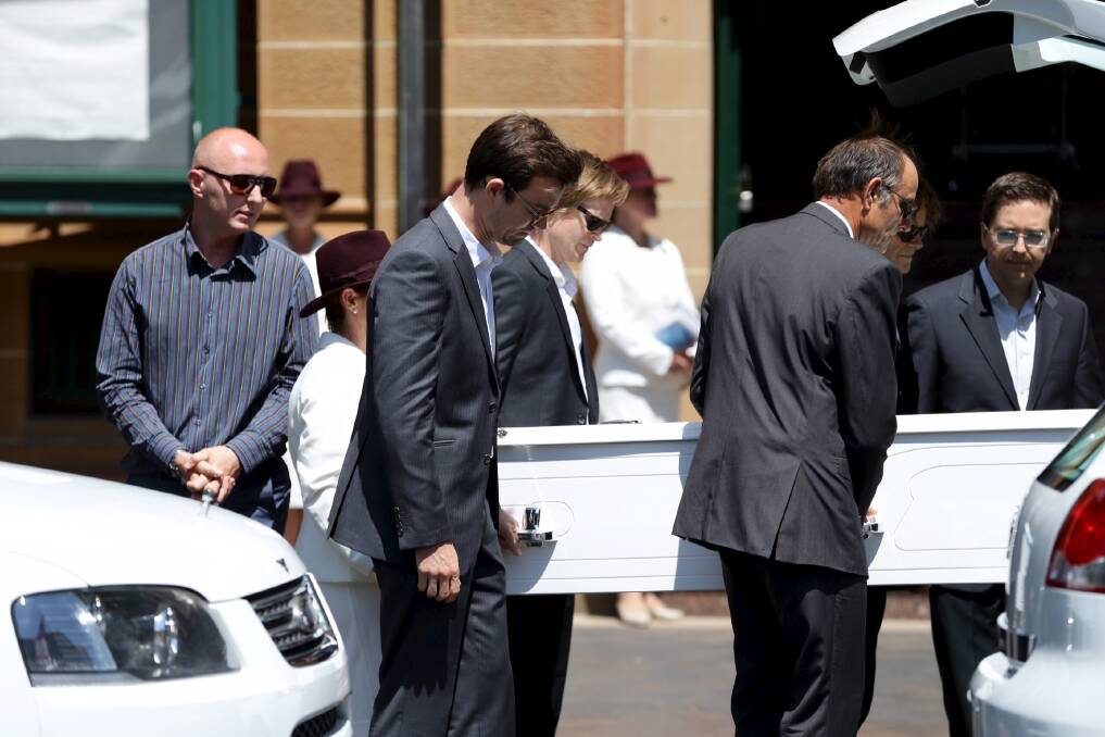 Family and friends carry Tori Johnson's casket into St Stephen's church Tuesday morning. Picture: WOLTER PEETERS