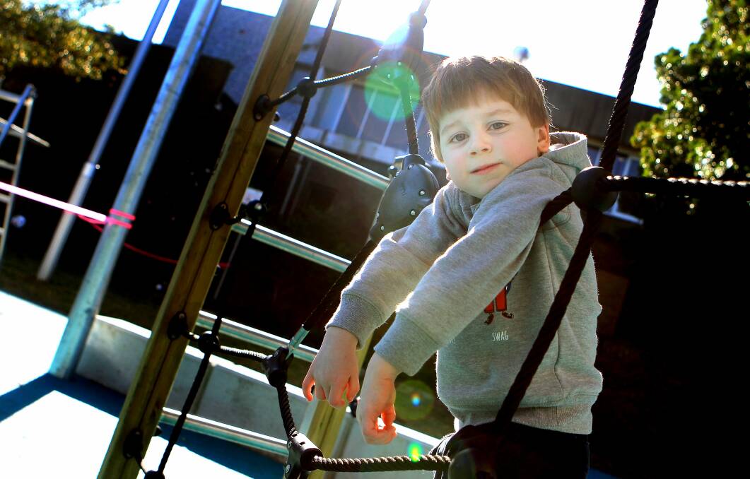Four-year-old Flynn Royall enjoying the play equipment. Flynn's grandfather Stephen Royall thinks the new play space is ‘‘fantastic’’. Picture: SYLVIA LIBER