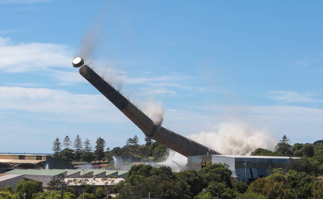 A cloud of dust emerged as the Port Kembla Copper stack fell yesterday. Picture: Kirk Gilmour