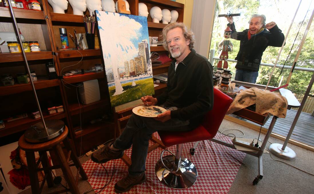 Archibald Prize entrant Donald Keys works as Scott Radburn watches on. Picture: ROBERT PEET.