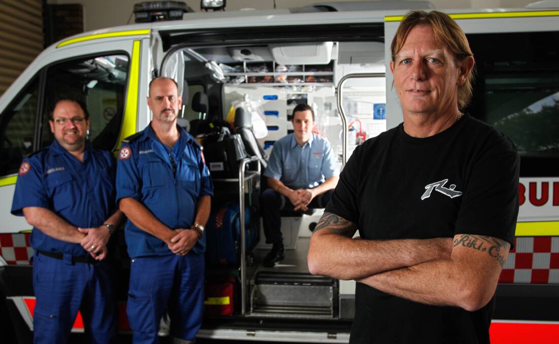 Darryl Palmer, 51 (front) who has been reunited with NSW Ambulance paramedics (L-R) Matthew Begaud, Martin Ryan and student Drew Hentschel who saved his life after having a cardiac arrest.