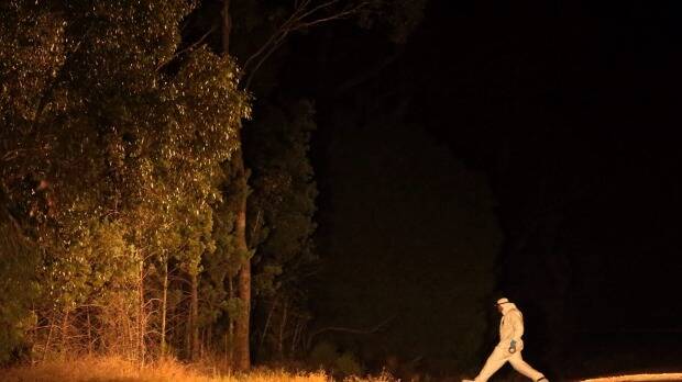 A forensic officer walks into Cocoparra National Park, where Stephanie Scott's body was found. Picture: Kate Geraghty