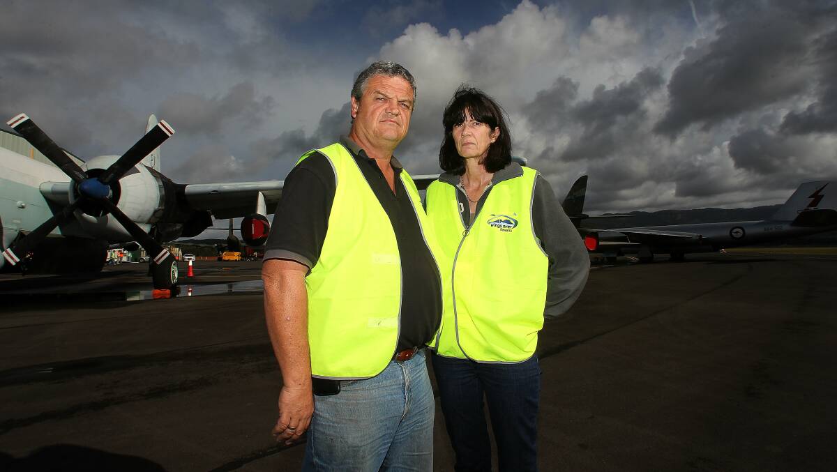 Devastated: Mark and Kerry Bright who made the decision to cancel this year's Wings Over Illawarra due to the wet weather. Picture: GREG TOTMAN