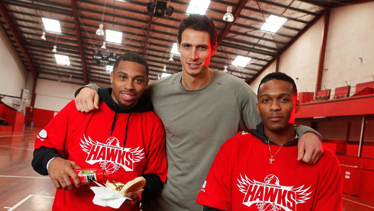 Hawks captain Oscar Forman with new recruits Gary Ervin, left, and Jahii Carson.  Picture: CHRISTOPHER CHAN
