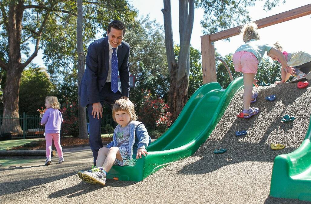 State member for Keira Ryan Park gets help from  son Preston, 4, at the   playground opening in Corrimal.  Picture: CHRISTOPHER CHAN
