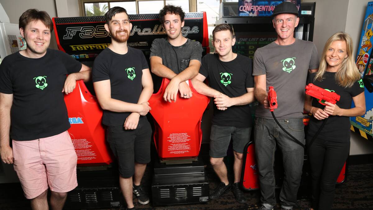 Wollongong game developers Mitchell Moore, Andrew Papanikolaou, Myles Cooley, Byron Papanikolaou, Michael Gardiner and Gretchen Armitage have signed a deal with TimeZone to take on the world of gaming using smartphones as controllers. Picture: GREG ELLIS