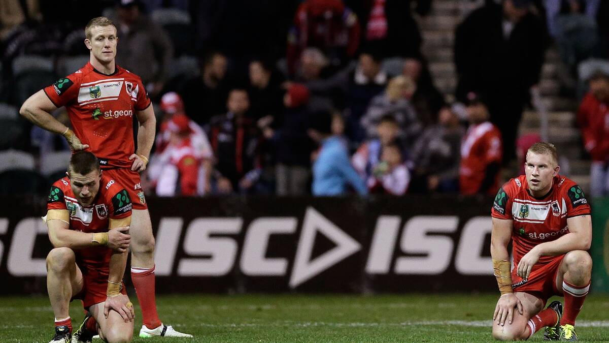 Dragons players look dejected after defeat against the Cowboys. Picture: GETTY IMAGES