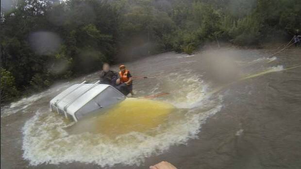 Three people were rescued from their car after becoming stuck in floodwaters at Moruya. Photo: Supplied
