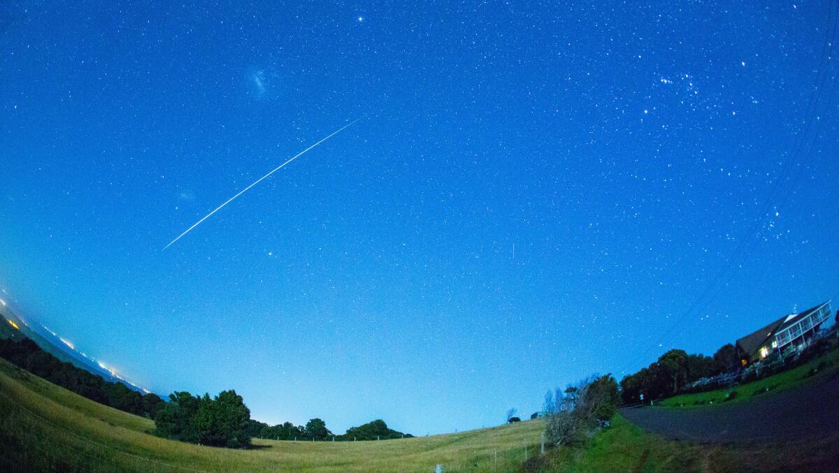 This  picture of the meteor shower was taken about 2.30am on Saddleback Mountain near Kiama. Picture courtesy: DAVID FINLAY
