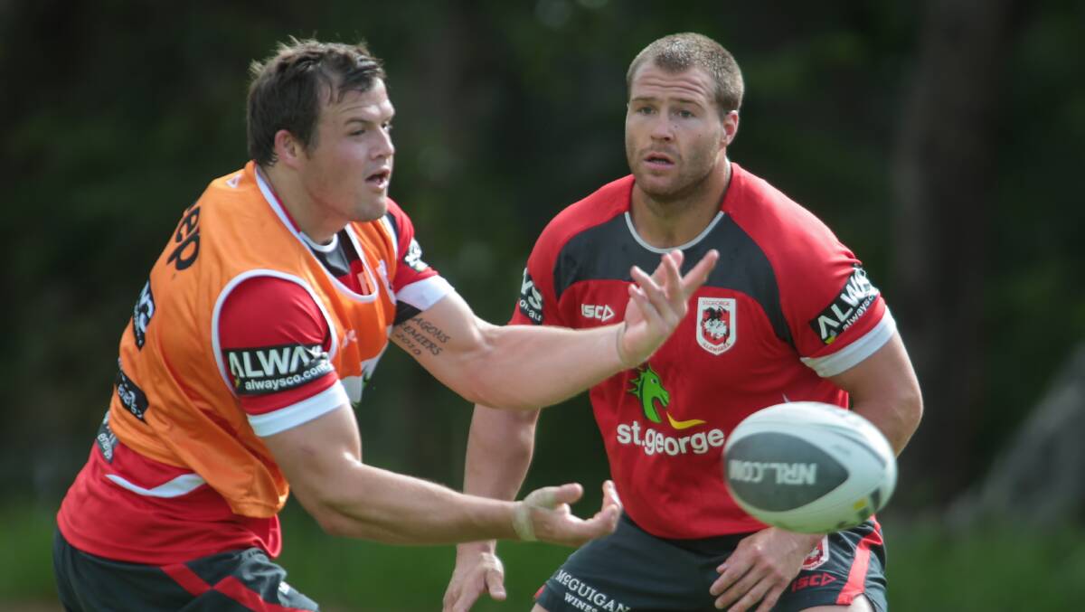 Dragons teammates Brett Morris and Trent Merrin at training earlier this year. Star winger Morris is said to be considering joining the Bulldogs. 