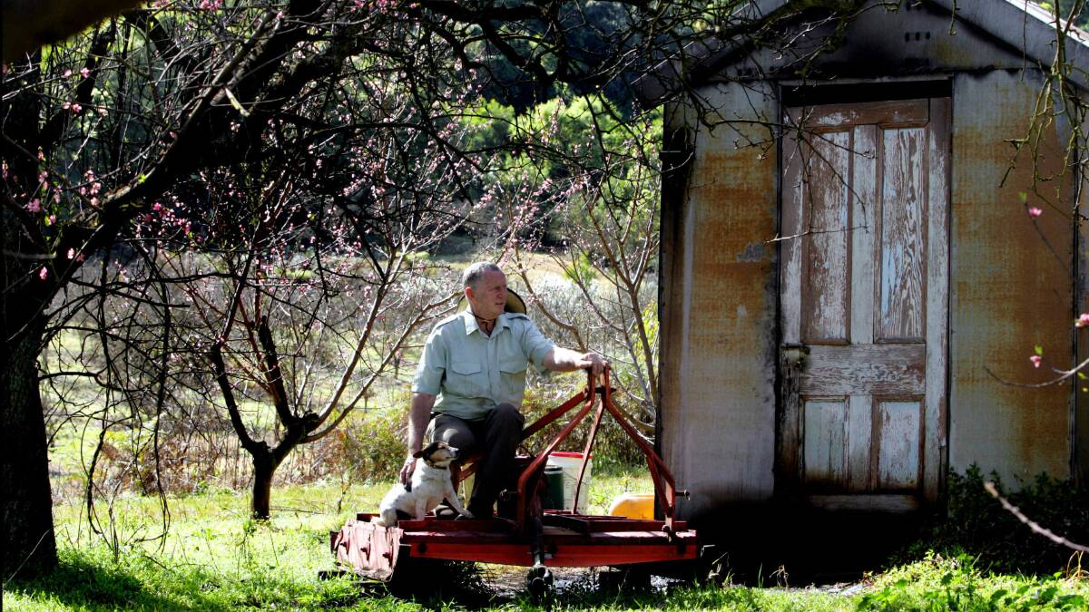 Last residents: In 2007 Bruce Rees closed the gate on his family’s Cordeaux River orchard after 120 years of operation.  Picture: KEN ROBERTSON