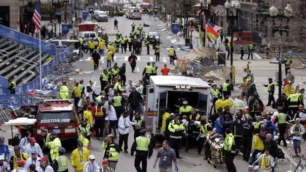 Medical workers aid injured people following the explosion at the finish line of the 2013 Boston Marathon in Boston. Picture: AP