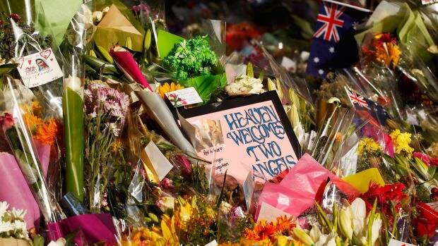 Flowers and messages left outside the Lindt Cafe in Sydney after last month's seige Photo: BRENDON THORNE