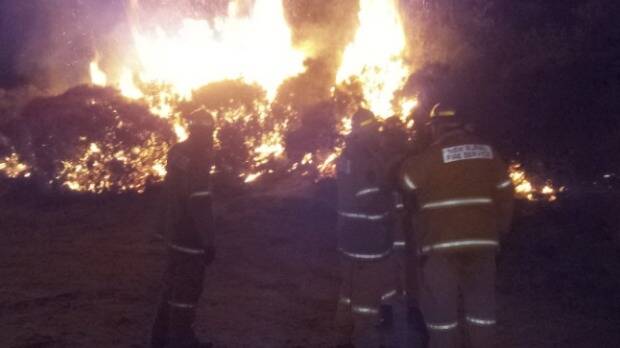 NSW Firemen keep a vigil on a fire at Wentworth Falls in the Blue Mountains. Picture: TNV NEWS
