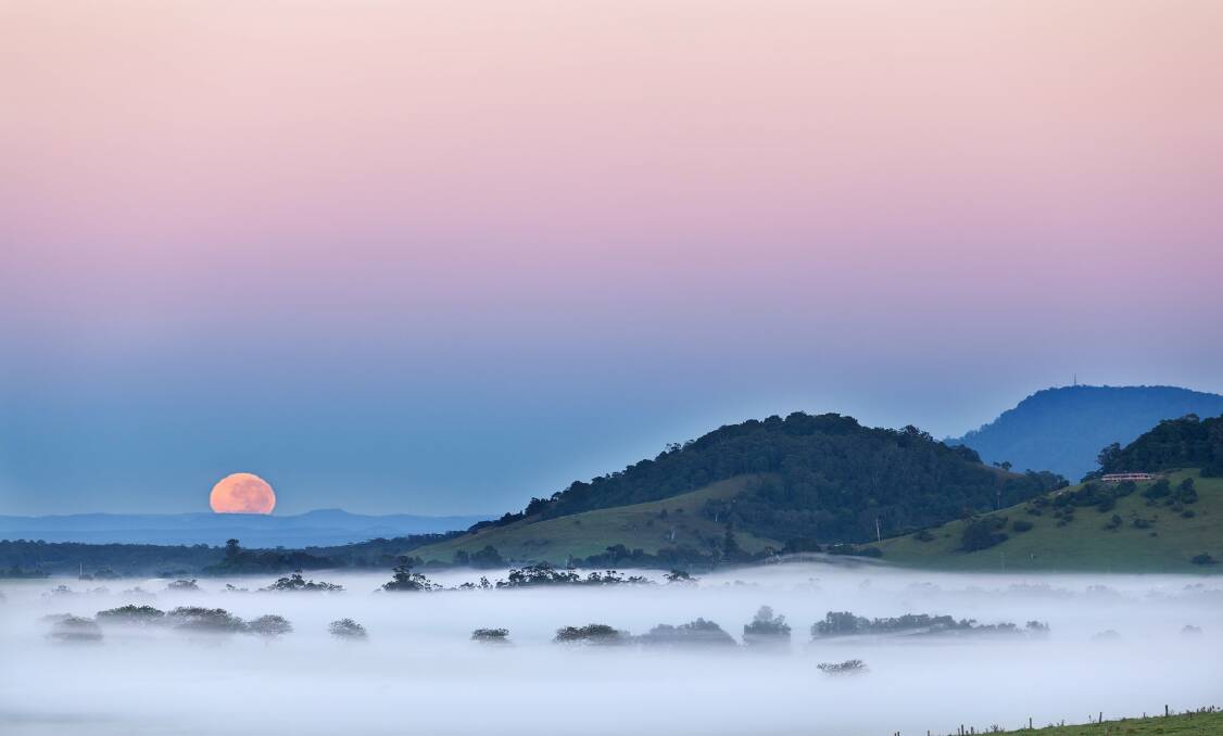 Gerringong resident Ian Mills won a Weatherzone photography competition with his image of a pink and blue colour phenomenon called anti-twilight arch, caused by the shadow of the earth at sunrise. 