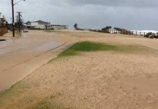 Sand covering the bike track and road near Towradgi beach. Picture courtesy of Henk Hofman.