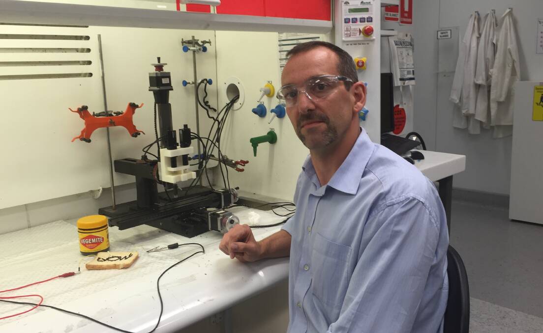Professor Marc in het Panhuis created a working 3D printed circuit to light up an LED bulb. Picture: SUPPLIED