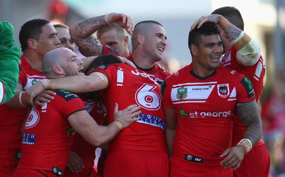 The Dragons celebrate after Benji Marshall scored a try during the match between the St George Illawarra Dragons and the Canberra Raiders at WIN Stadium.