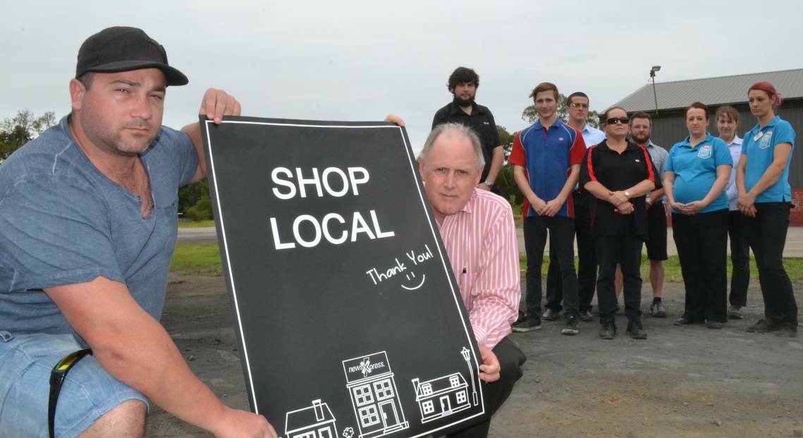 Brendon Lord and Wes Hindmarsh along with Bomaderry workers Chris Emery, Brendan Kellett, Joel Lord, Rosa Sharman, Adam Pritchett, Stacey Alexander, Debbie Simpson and Sarah Newton fear a proposed Woolworths complex in Bomaderry will “kill local supermarkets".
