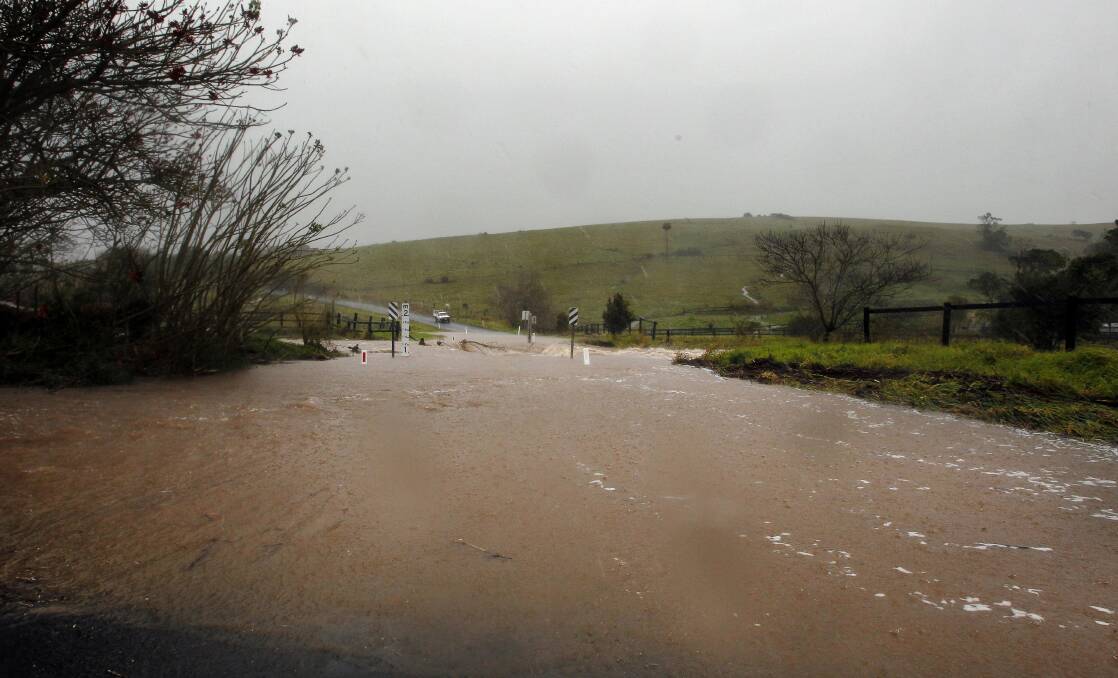 Torrential rain caused flooding on Mt Brandon Road near Jerrara Dam on Tuesday morning. Picture: SYLVIA LIBER