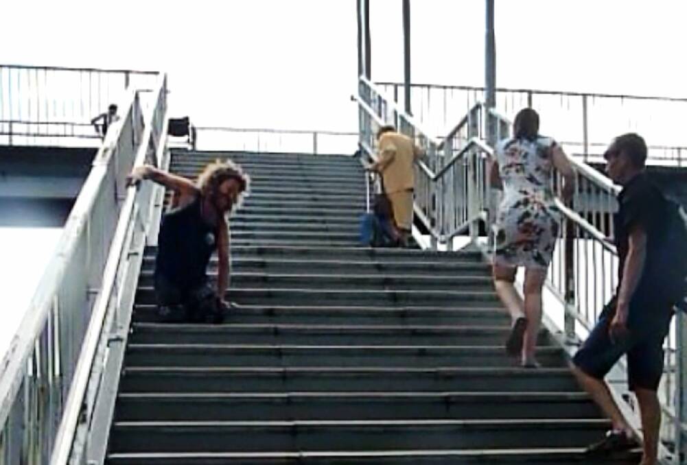 The NSW Transport Minister has labelled footage of a double amputee crawling up the stairs at Unanderra train station as ‘‘distressing’’. 
