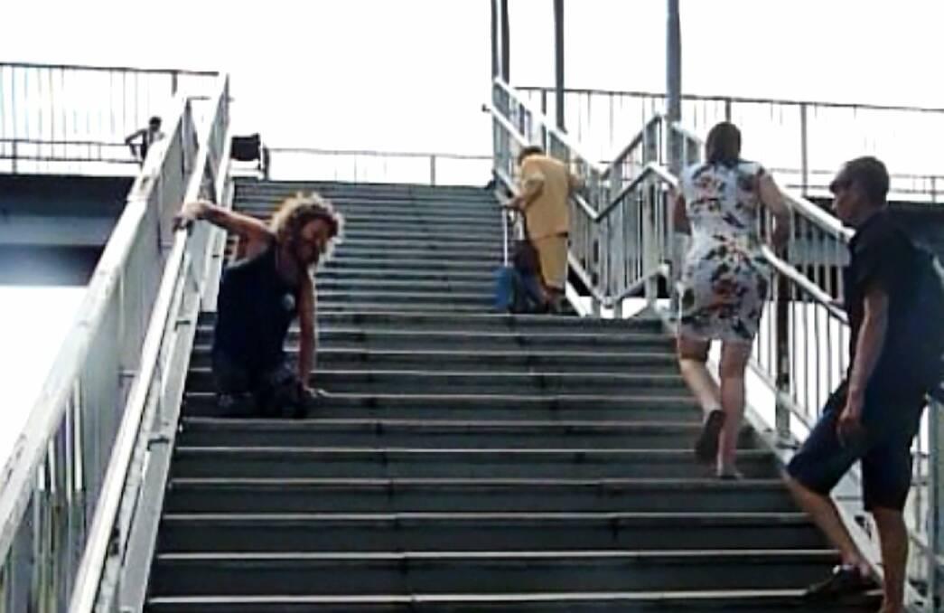 The NSW Transport Minister has labelled footage of a double amputee crawling up the stairs at Unanderra train station as ‘‘distressing’’. 