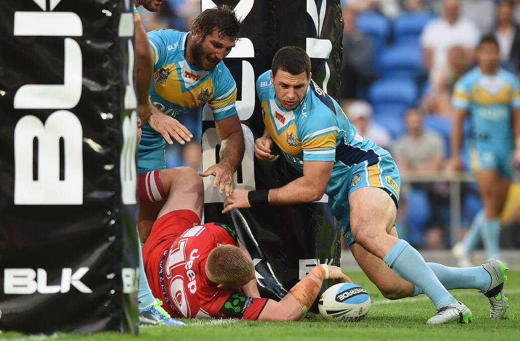 Mike Cooper of the Dragons scores a try during the round 25 NRL match between the Gold Coast Titans and the St George Illawarra Dragons at Cbus Super Stadium. Picture: GETTY