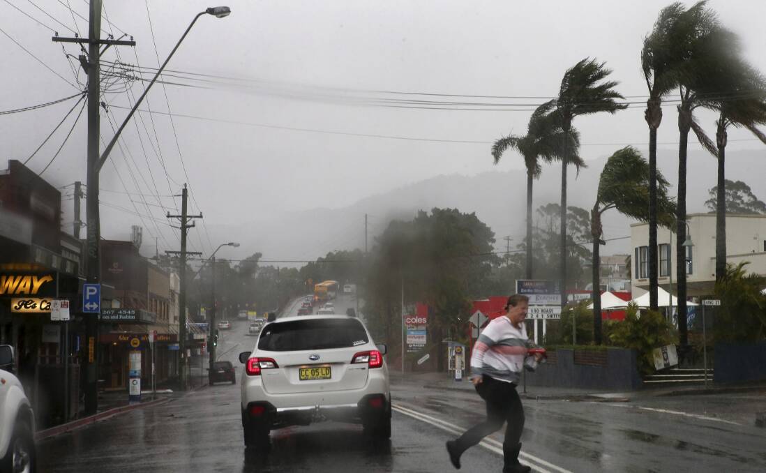 Traffic banks up on Lawrence Hargrave Drive at Thirroul as wild winds and heavy rain impact the Illawarra region. Picture: KIRK GILMOUR
