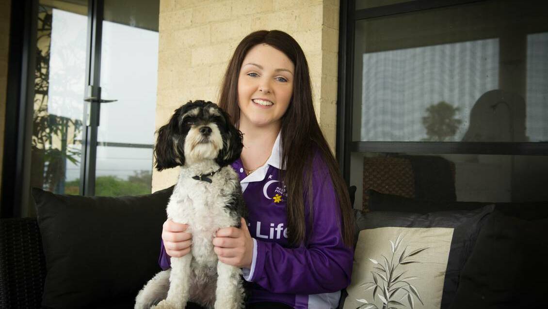 Proud Relay for Life participant Ashleigh Collins died in the early hours of Saturday. Pictured with her dog Lulu. Picture: ALBEY BOND