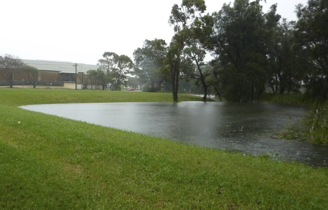 The proposed site for the new Warilla library at Keith Fletcher Park has been flooded after recent heavy rain. Picture: supplied.