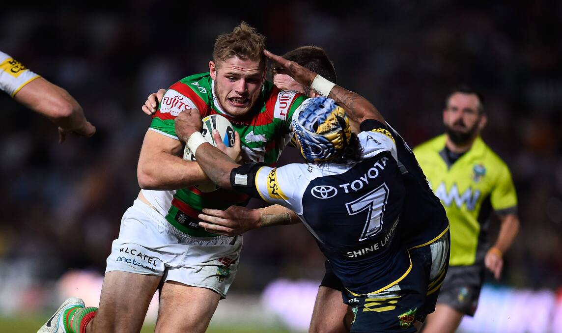 Tom Burgess of the Rabbitohs barges into Johnathan Thurston of the Cowboys during the round 23 NRL match at 1300SMILES Stadium in Townsville on Thursday night. Picture: GETTY IMAGES