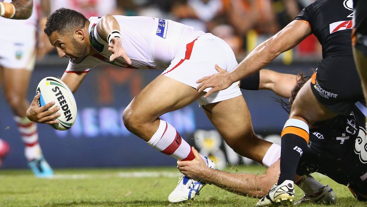 St George Illawarra's Benji Marshall attempts to elude Wests Tigers tacklers during Monday night's NRL match at Campbelltown. Picture: GETTY IMAGES