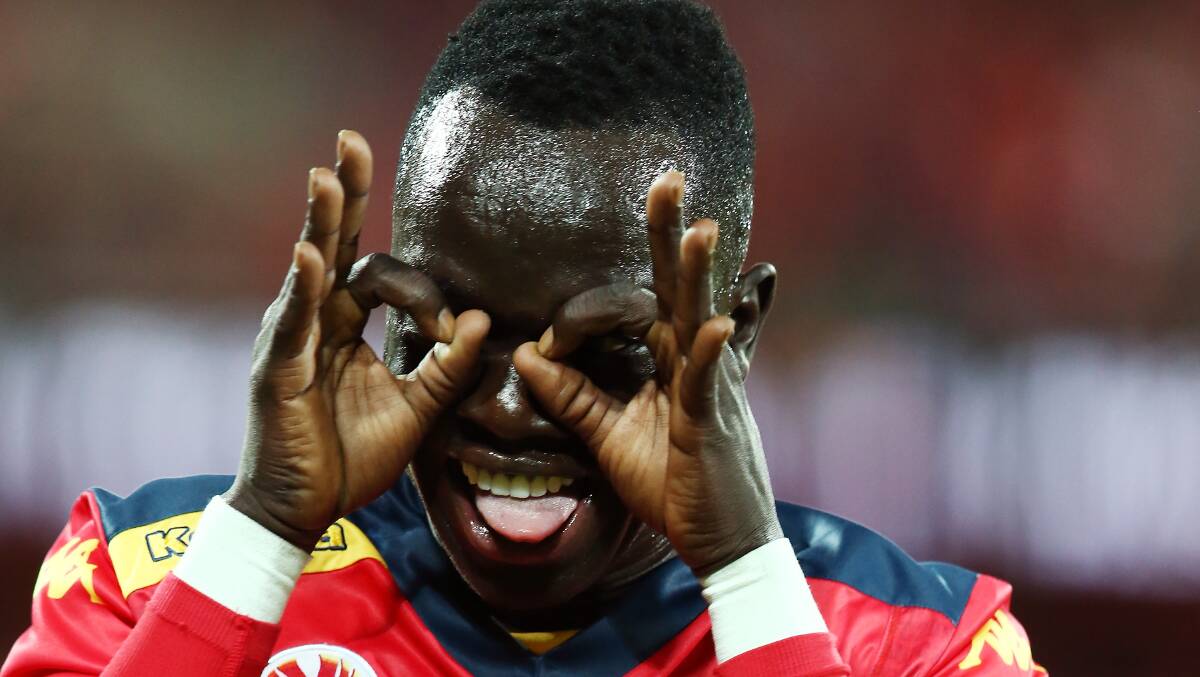 Awer Mabil reacts after scoring the match-winning goal for Adelaide United in the A-League finals match against Brisbane at the Adelaide Oval on Friday night. Picture: GETTY IMAGES