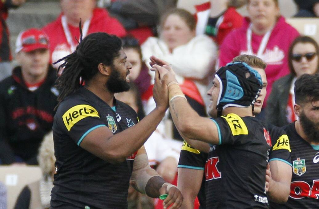 Penrith's Jamie Soward (right) and Jamal Idris celebrate victory over the Dragons on Sunday. Picture: ANDY ZAKELI