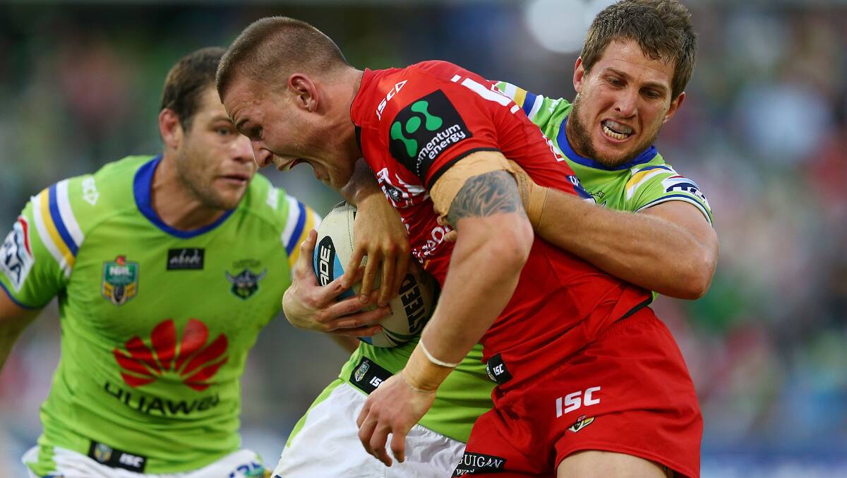 Dragons centre Euan Aitken is tackled by Josh Hodgson of the Raiders during Saturday's match at GIO Stadium in Canberra. Picture: GETTY IMAGES