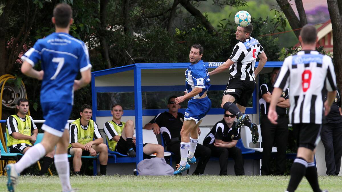 Port Kembla's Carlo Stella heads the ball during the match against Tarrawanna. Picture: SYLVIA LIBER
