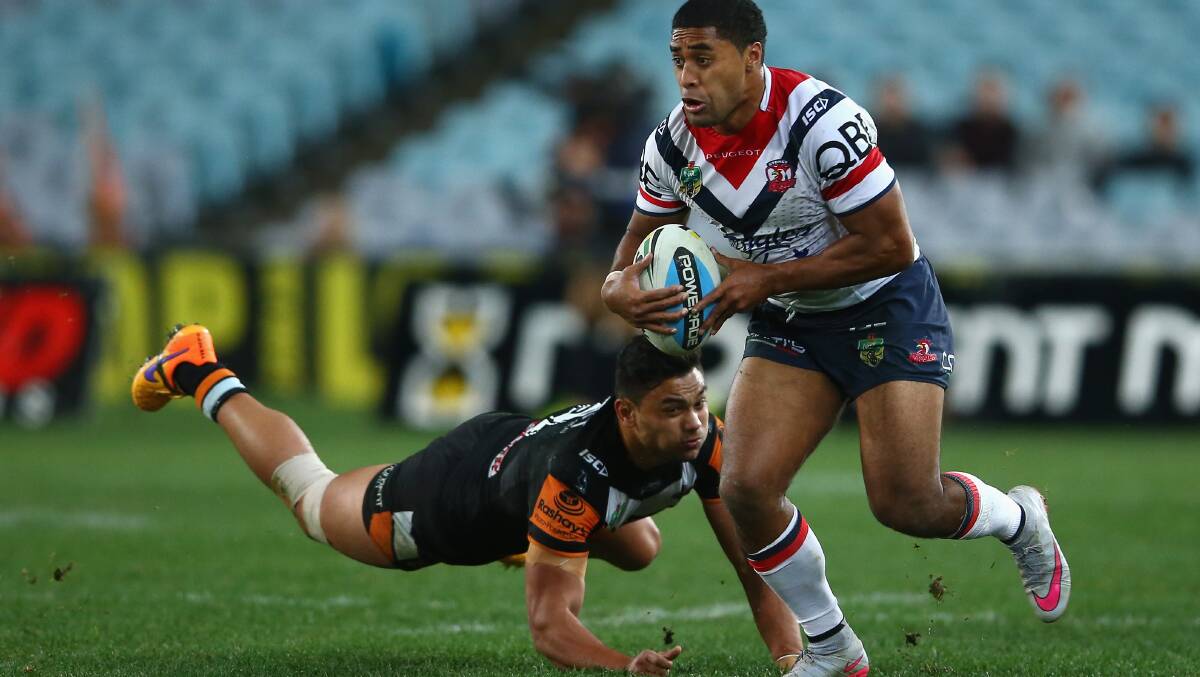 Michael Jennings of the Roosters makes a break during the match against the  Wests Tigers at ANZ Stadium on Friday night. Picture: GETTY IMAGES