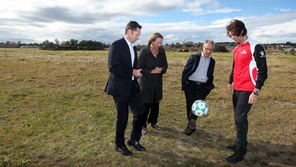 Labor MPs Stephen Jones and Sharon Bird, Eddy De Gabriele and ex-Wolves player Jacob Timpano at the West Dapto field last year. Picture: SYLVIA LIBER