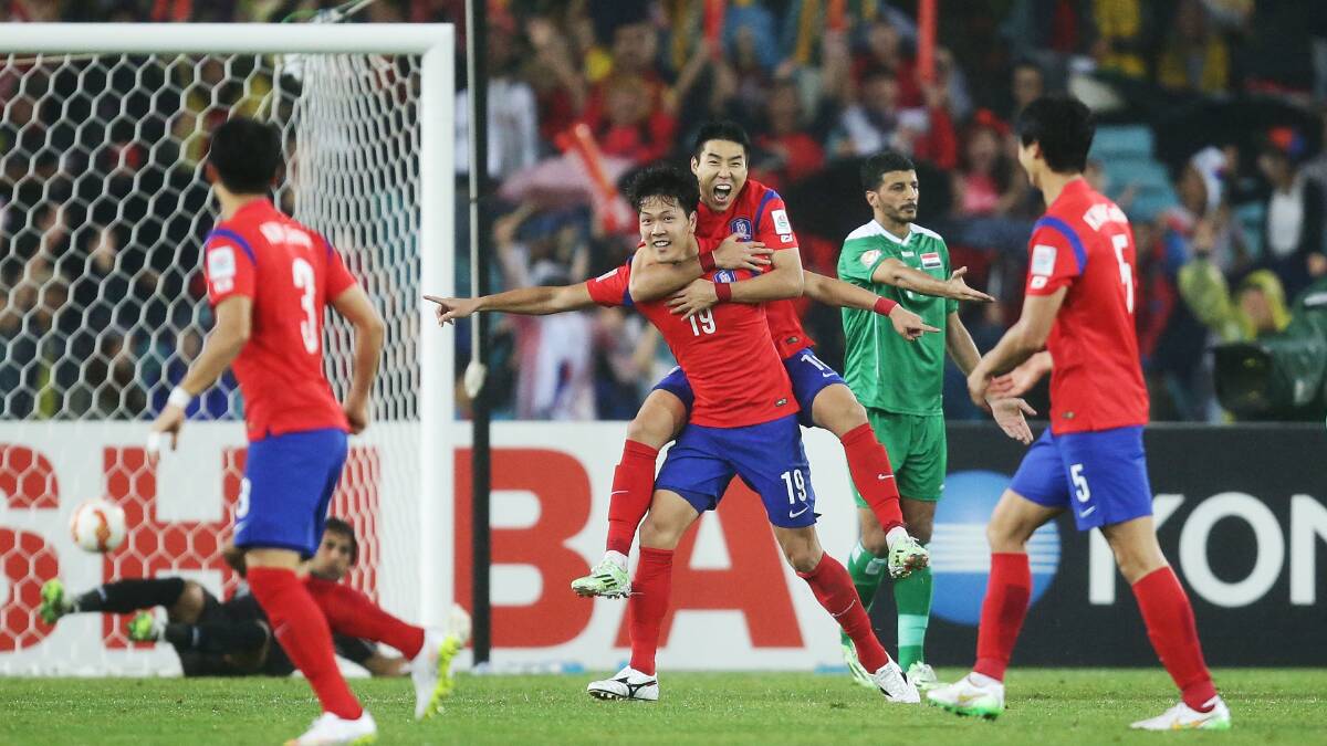 South Korea's Kim Young Gwon celebrates with teammates after scoring the second goal during the Asian Cup semi-final against Iraq at ANZ Stadium in Sydney on Monday night. Picture: GETTY IMAGES