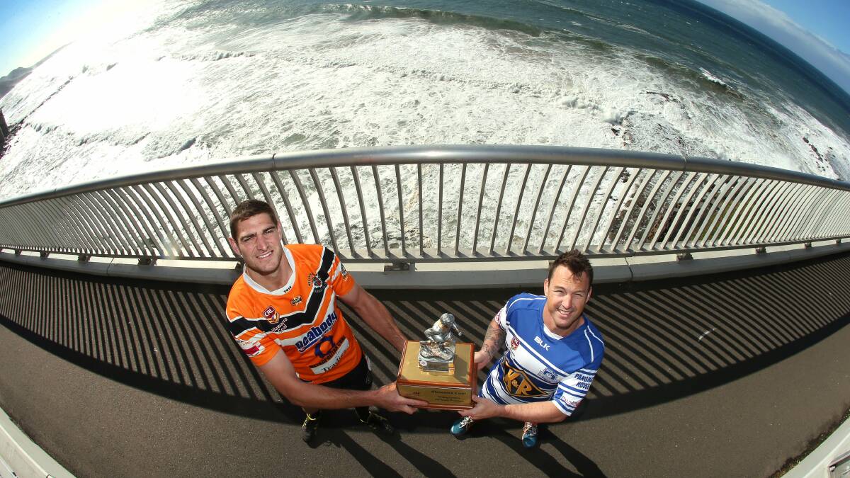 Helensburgh captain Steve McCallum (left) and Thirroul's Nathan Fien meet on the Sea Cliff Bridge holding the Illawarra Coal Cup trophy. The two teams meet in Sunday's grand final decider. Picture: KIRK GILMOUR