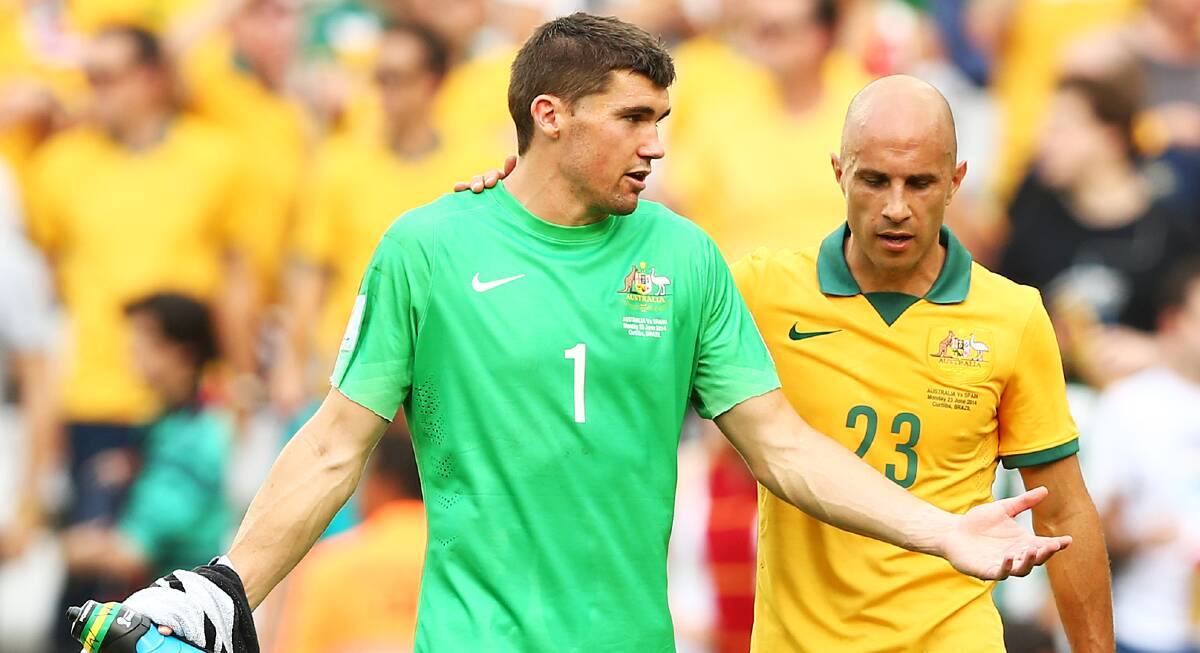 Socceroos goalkeeper Mat Ryan and midfielder Mark Bresciano after Tuesday's 3-0 loss to Spain. Picture: GETTY IMAGES
