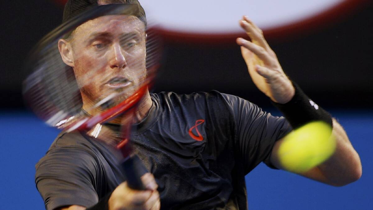 Lleyton Hewitt in action against Zhang Ze in the first round of the Australian Open on Tuesday night. Picture: REUTERS