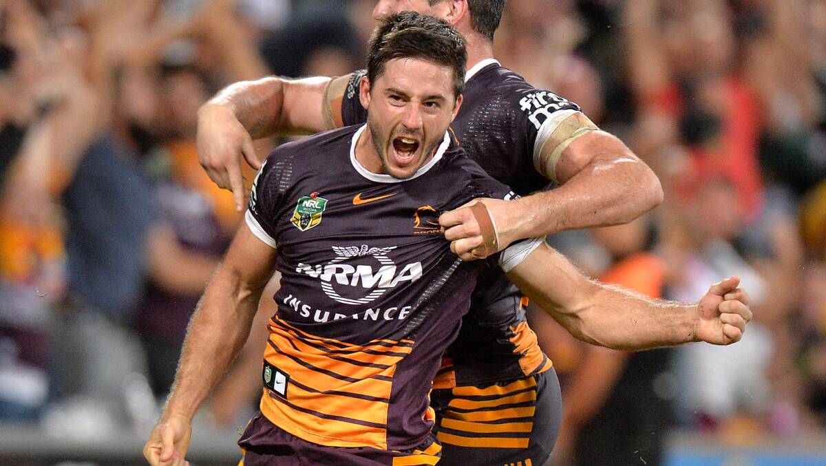 Ben Hunt celebrates after scoring the match-winning try for Brisbane on Friday night. Picture: GETTY IMAGES