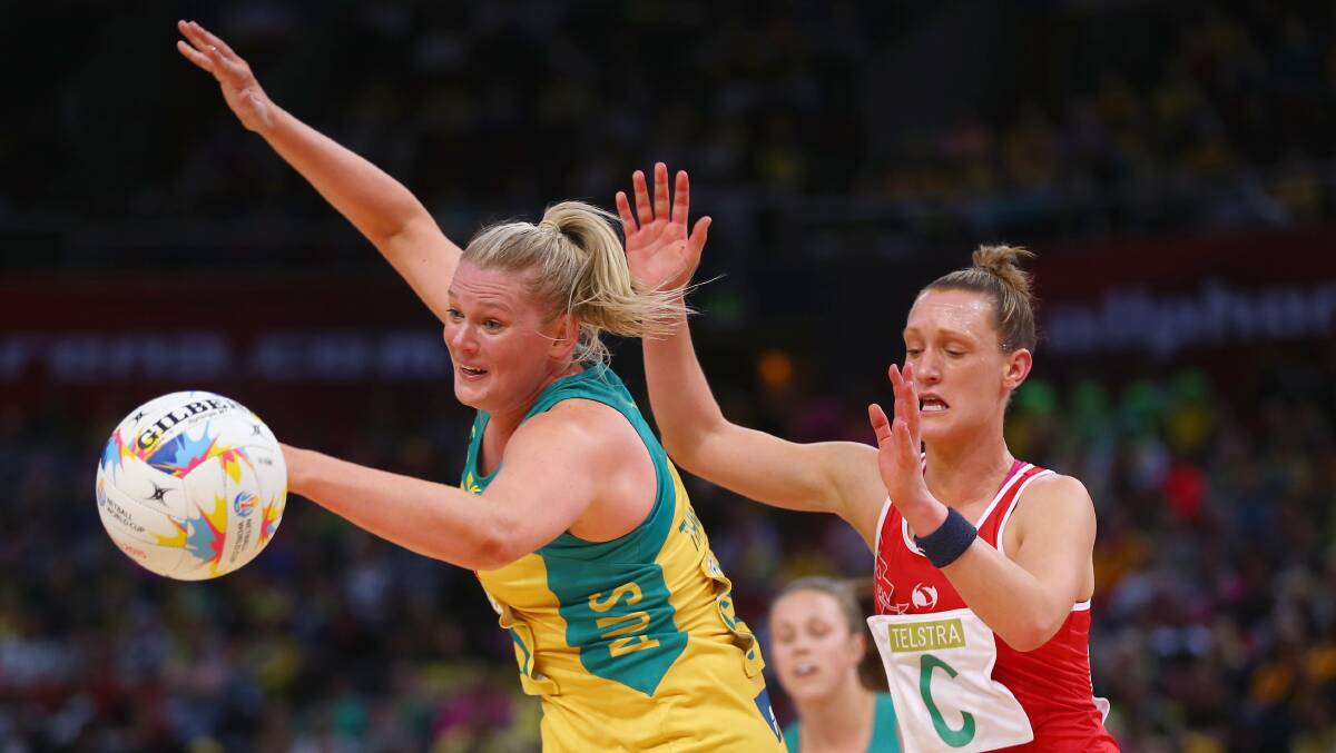 Australia's Caitlin Thwaites and Kyra Jones of Wales compete for the ball during the Netball World Cup match at Allphones Arena on Friday night. Picture: GETTY IMAGES