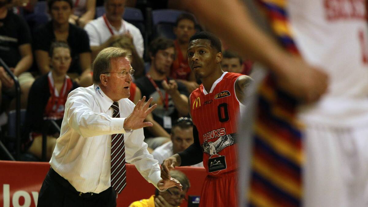 Hawks coach Gordie McLeod gives instructions to Jahii Carson during Friday night's match against the Adelaide 36ers. Picture: SYLVIA LIBER
