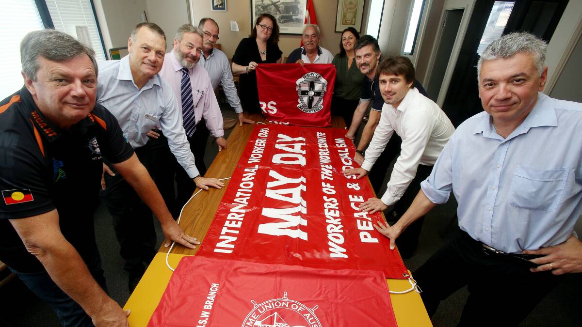 Members of the South Coast May Day Committee get ready to roll out the banners for this year’s event. Picture: ROBERT PEET