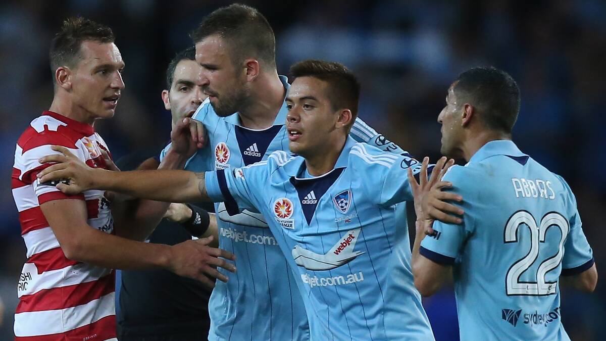 Wollongong’s Western Sydney Wanderers star Brendon Santalab in a heated exchange with Sydney FC’s Ali Abbas (right), amid a racial abuse claim that was  dismissed by the FFA’s independent disciplinary committee on Thursday. Picture: GETTY IMAGES