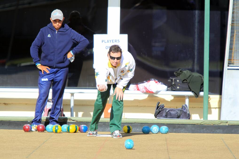 Dapto Citizens' Trevor Gillis plays his bowl during his victory with partner Aaron Spears in the zone 16 open pairs final at Windang Bowling Club. Picture: SYLVIA LIBER